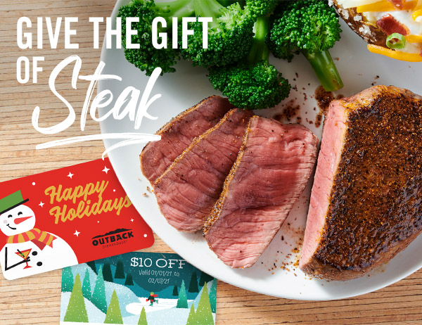 aerial image fro a plate of steak and broccoli with gift cards nearby