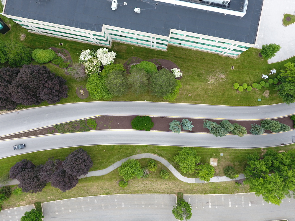 aerial view of roadway with a median in the center and grass on either side