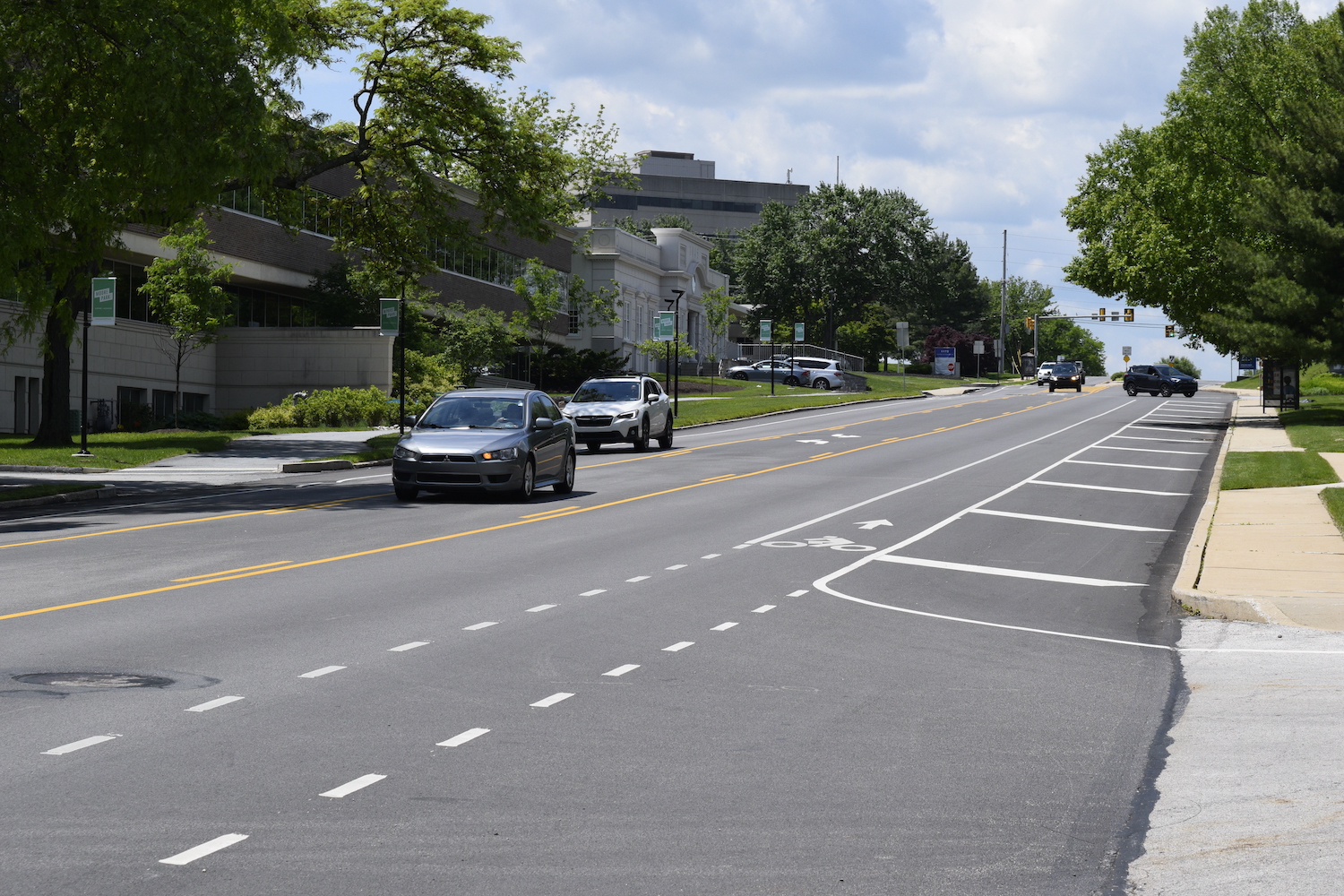 roadway with cars on it and a bike lane