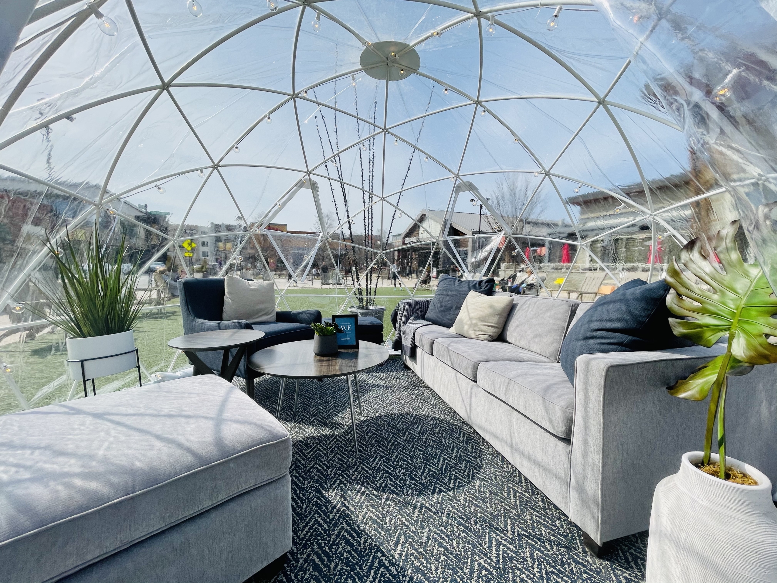 Living room furniture inside of a clear igloo outdoors