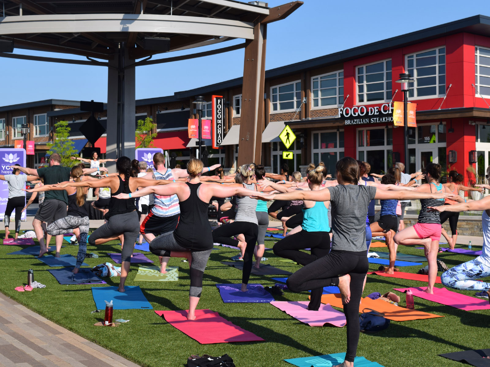 people doing an outdoor yoga class