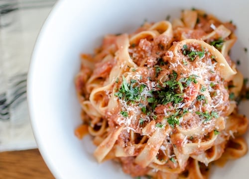 noodle and sauce dish with grated cheese