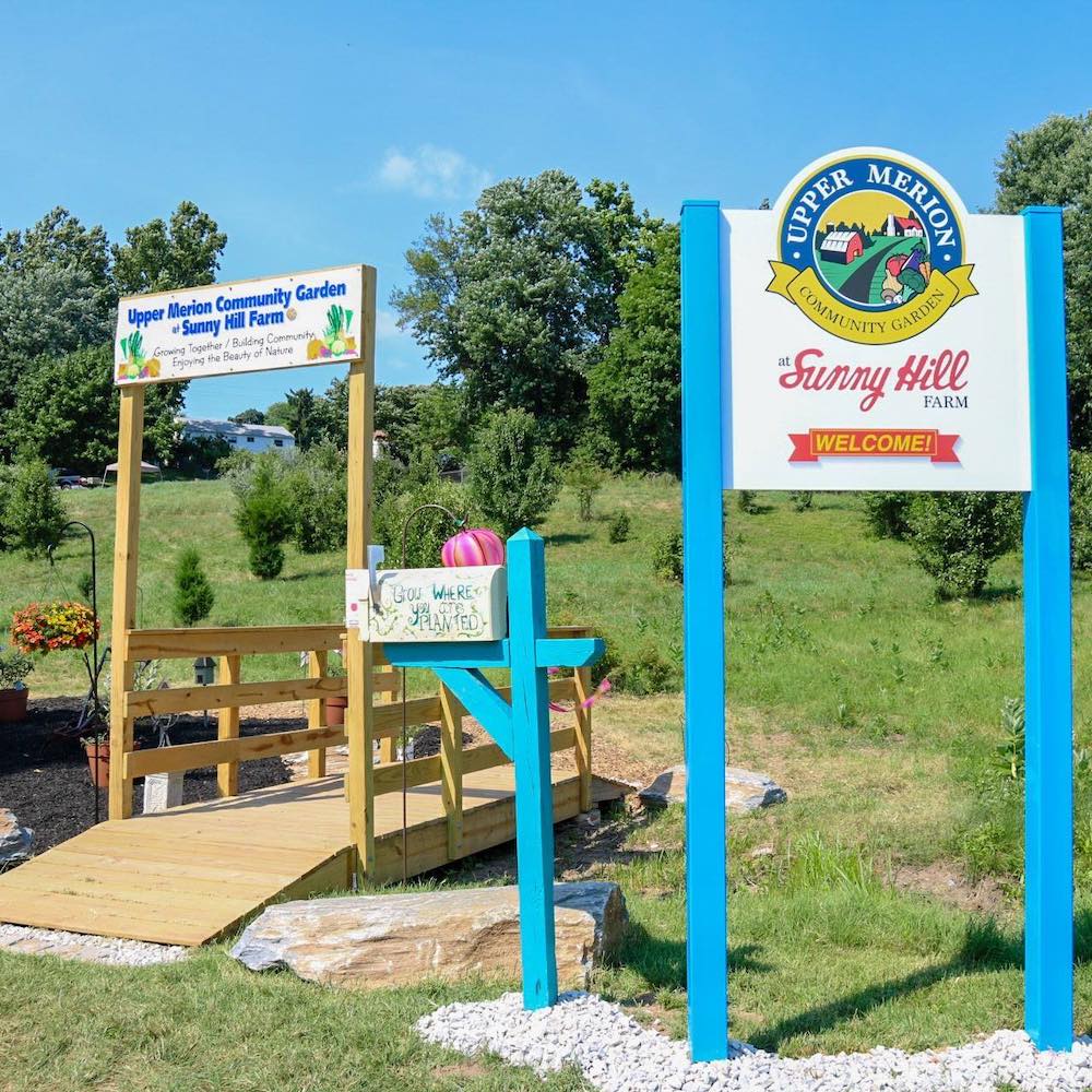 community garden welcome sign