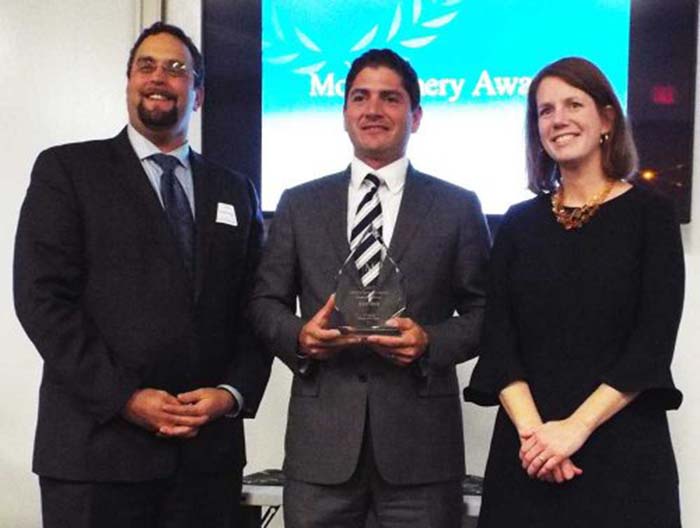 award being presented on stage