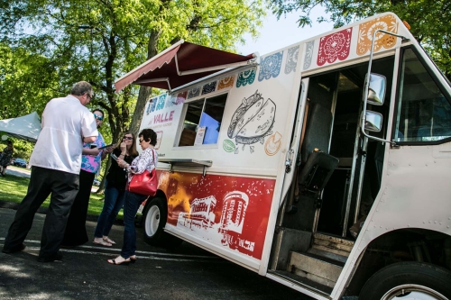 people next to a food truck