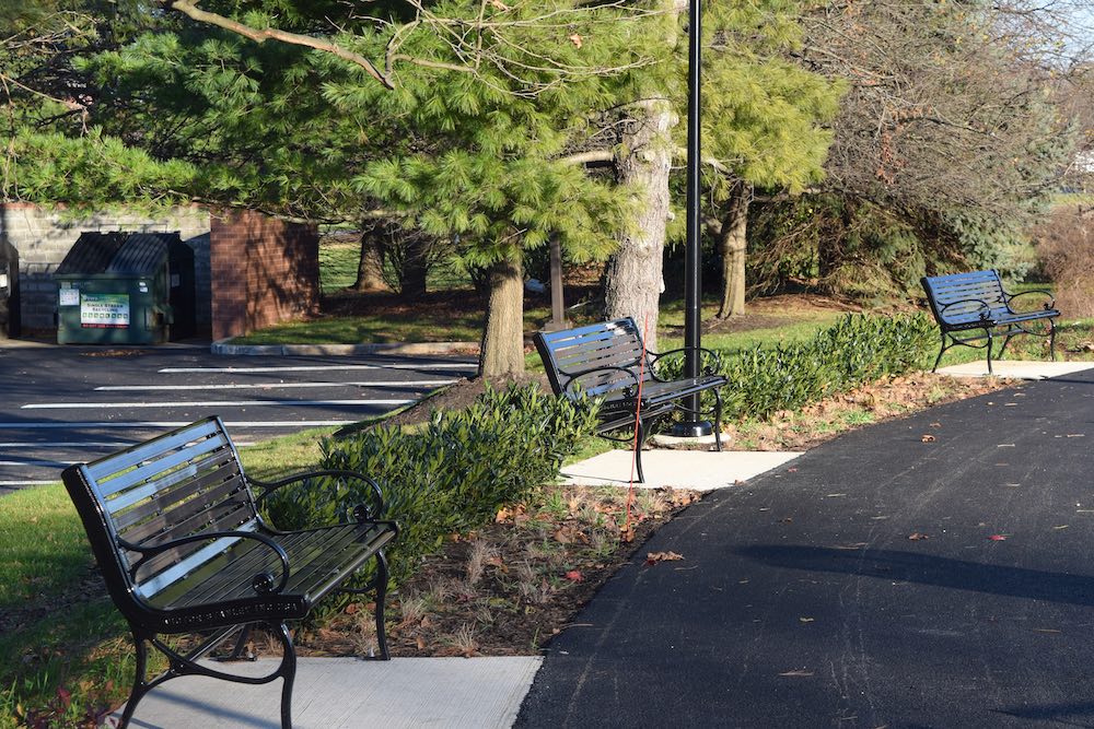 outdoor path with benches alongside