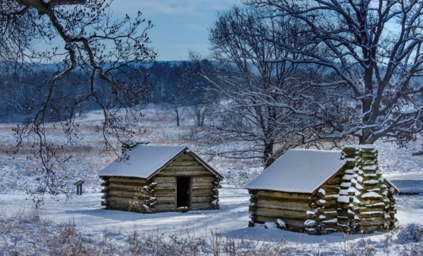 huts in valley forge park covered in snow