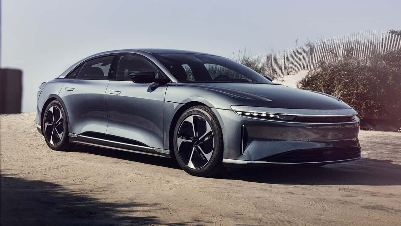 lucid air car outdoors on dirt road