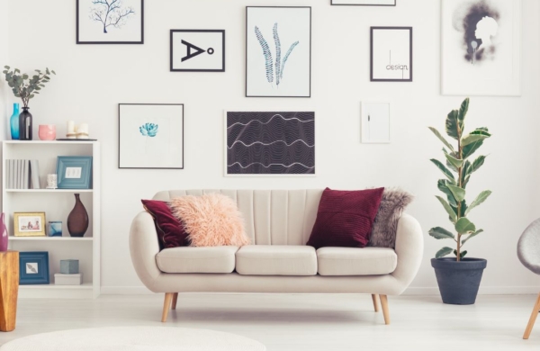 couch surrounded by wall art