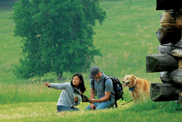 couple with a dog outdoors