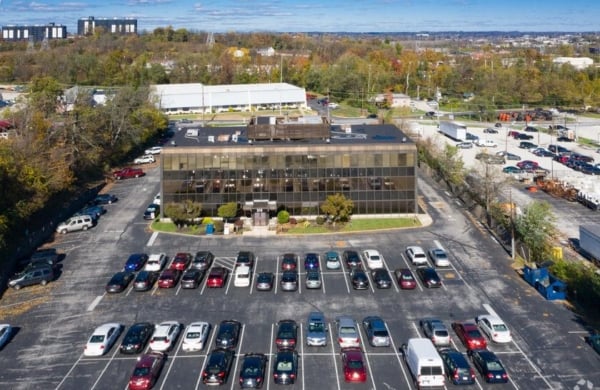 aerial view of a building and parking lot