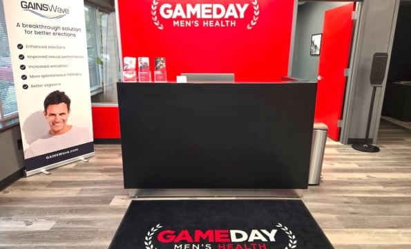 gameday mens health in King of Prussia's front reception area featuring a bright red wall and black desk