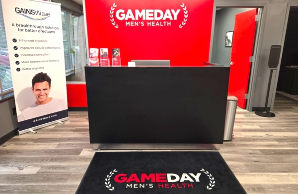 gameday mens health in King of Prussia's front reception area featuring a bright red wall and black desk