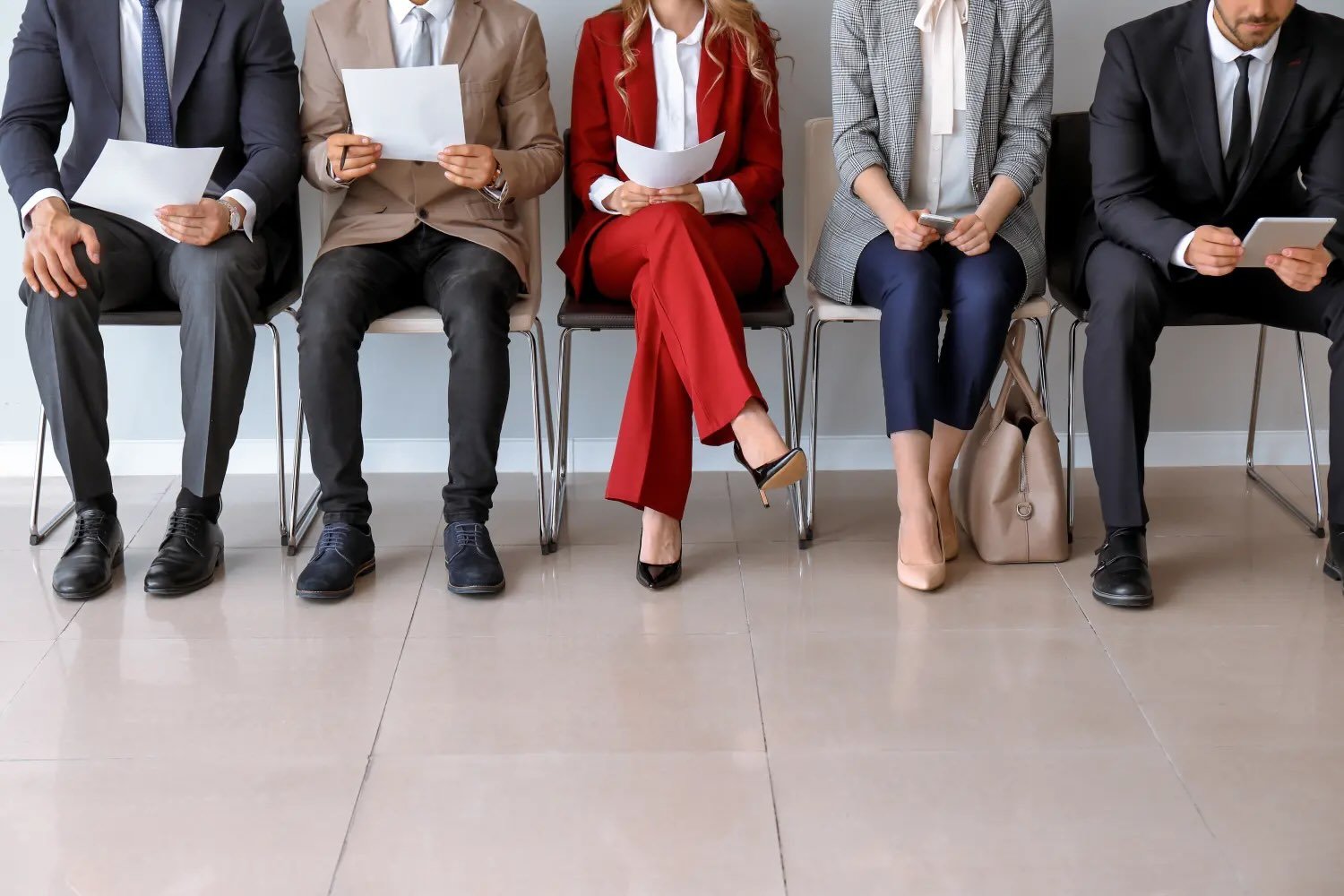 people in chairs holding a piece of paper