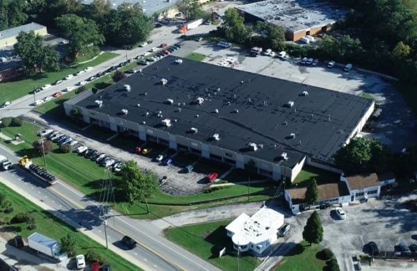 birds eye view of large building and parking lot