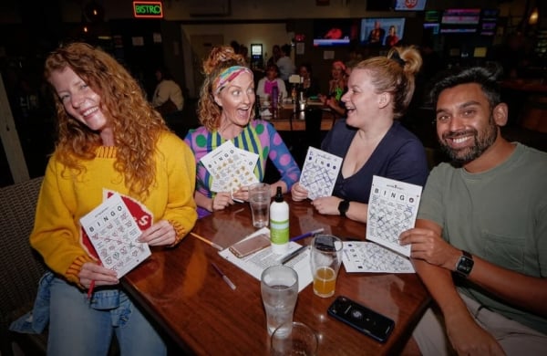 people smiling and playing bingo