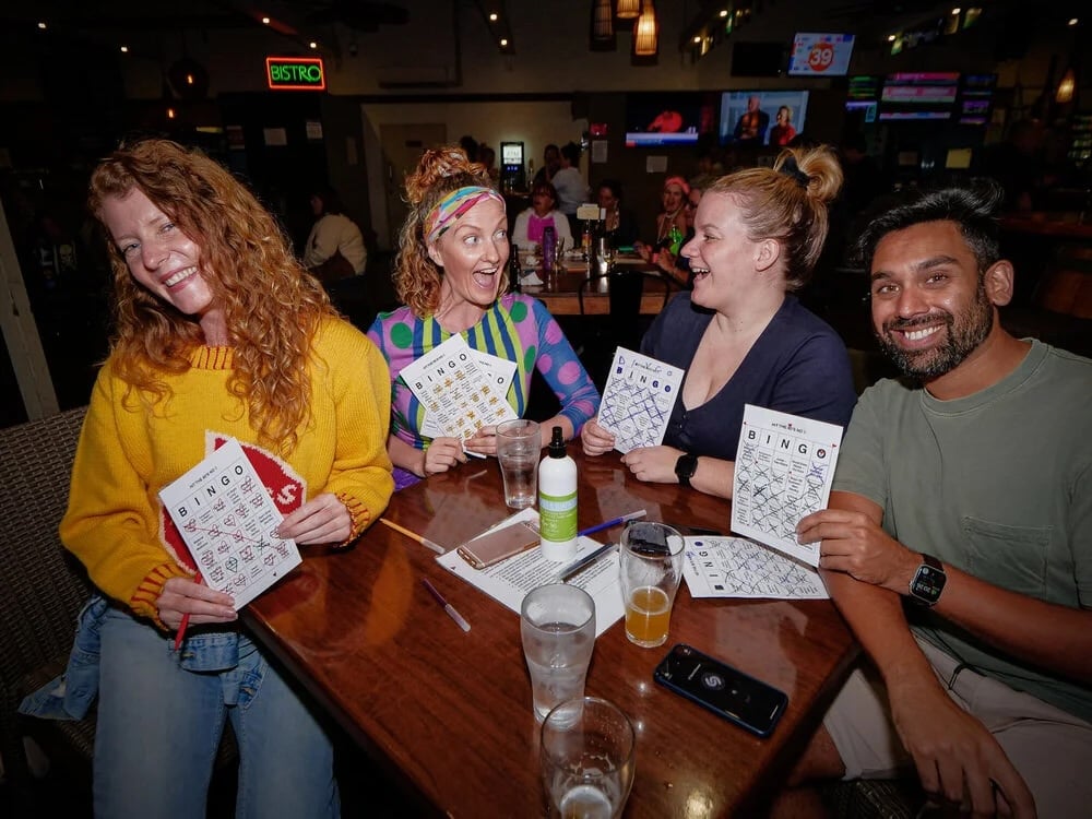 people smiling and playing bingo