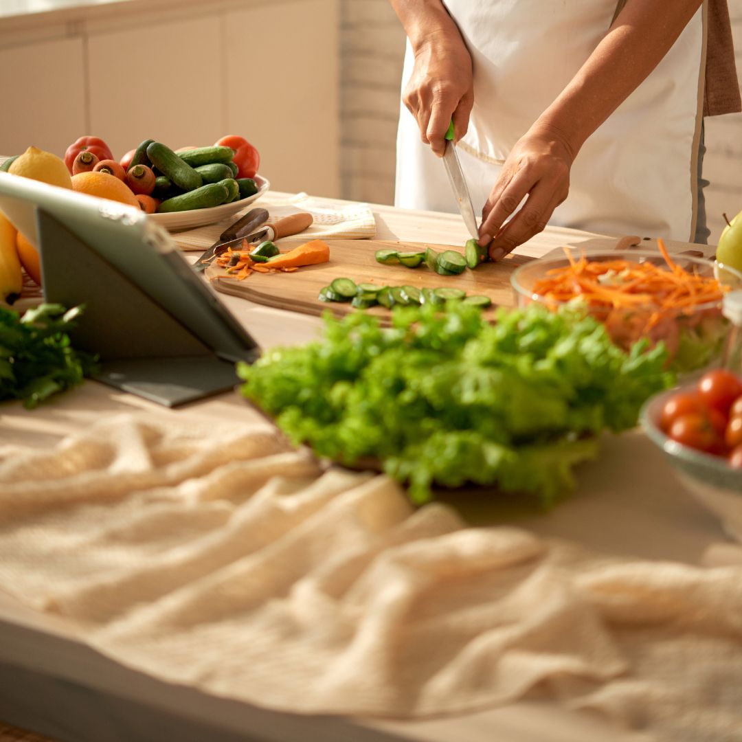 person chopping vegetables