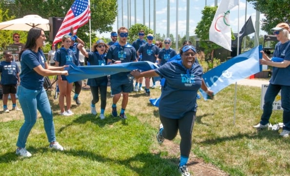 person running through a ribbon