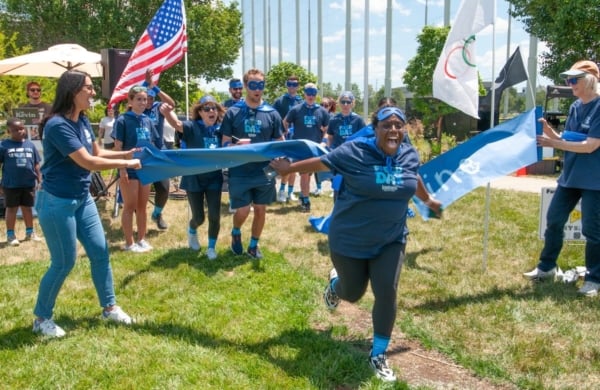 person running through a ribbon