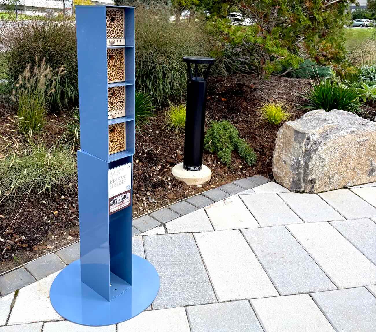 vertical wild beehome on a paved area with landscapes area in the abckground