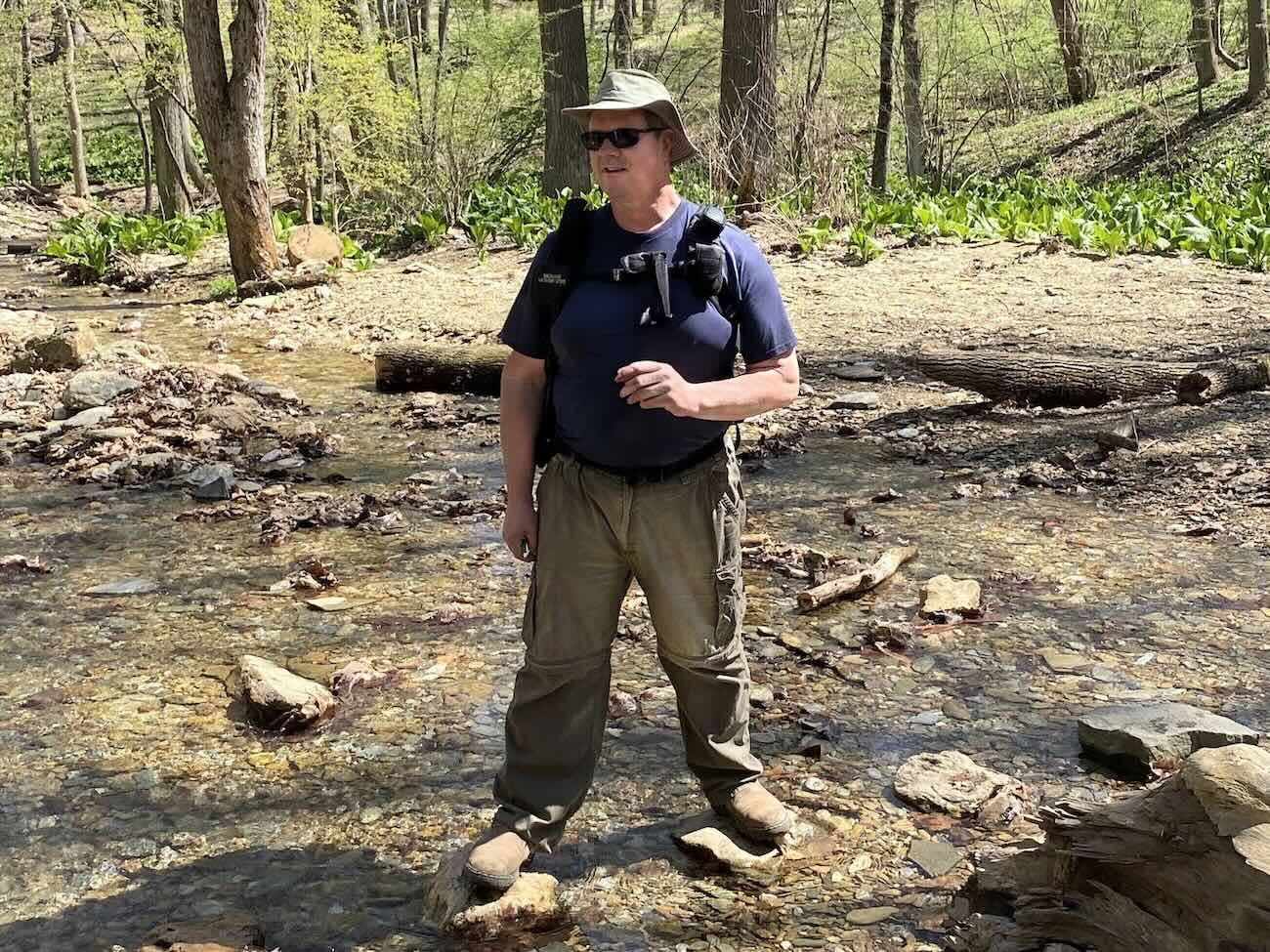person standing in a creek